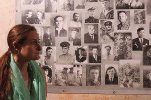 At the wall of the Memorial Museum 35th Battery Sevastapol, we lit candles… my eyes scanned all the faces, and I became curious about who was in the bottom left corner.